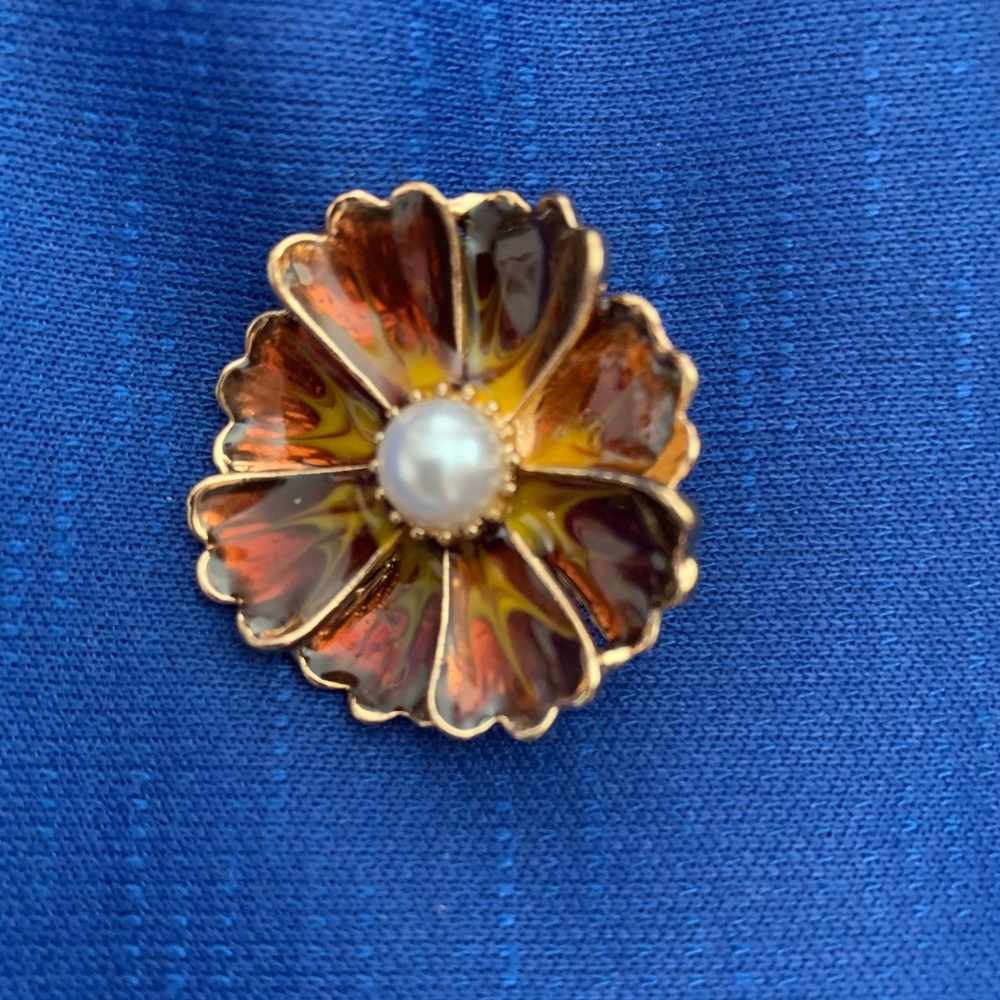 Orange, red and yellow flower with pearl snap